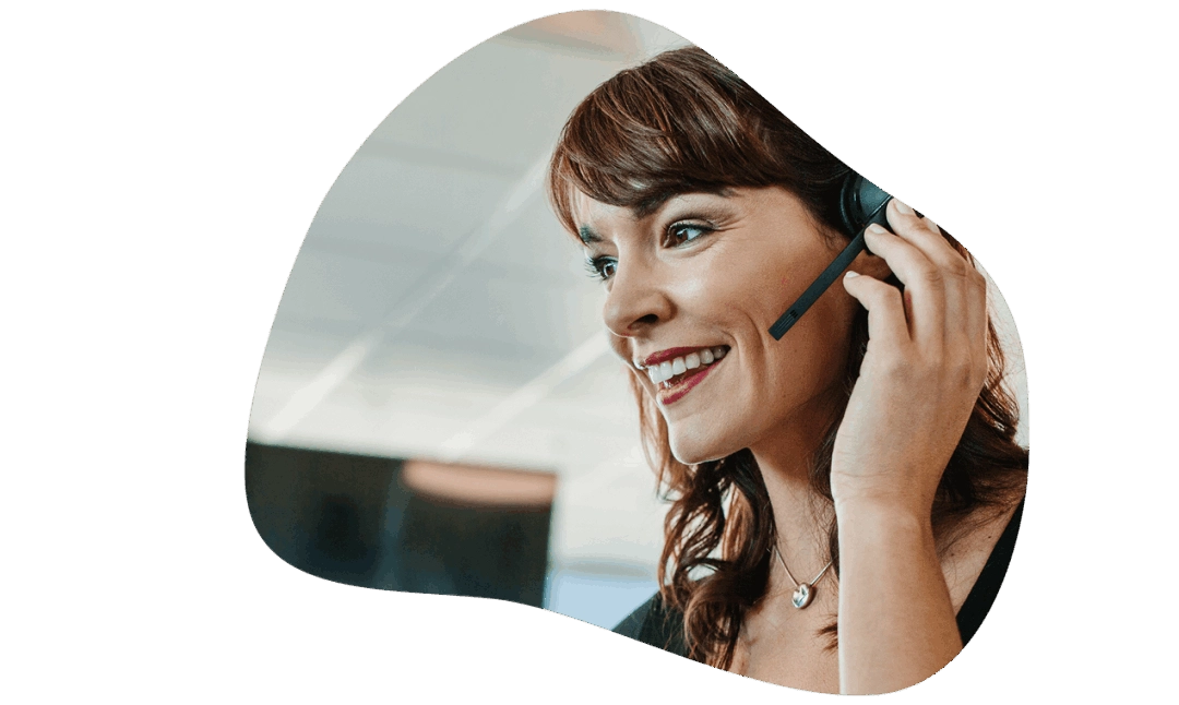 Woman talking on Telarite business phone service using a headset working in call centre